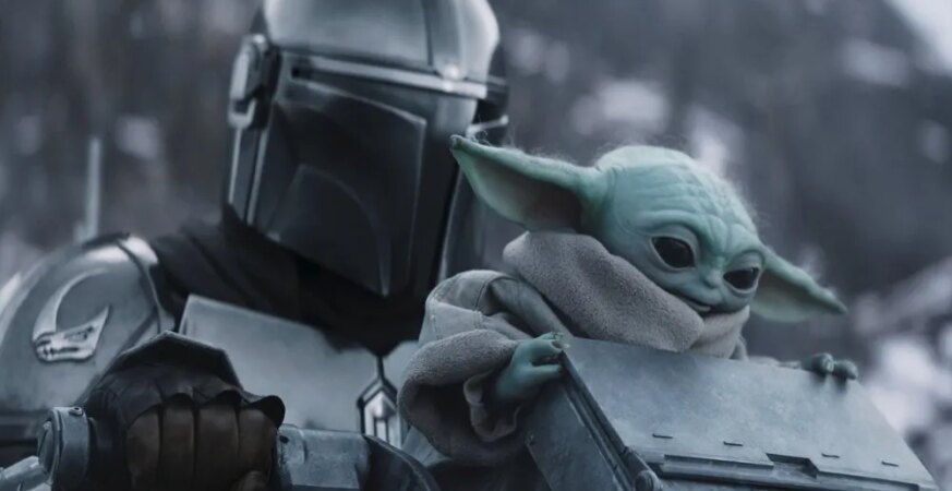 STAR WARS: THE MANDALORIAN AND GROGU, from left: Pedro Pascal as The Mandalorian / Din Djarin, Grogu, 2026. © Walt Disney Studios Motion Pictures / Courtesy Everett Collection