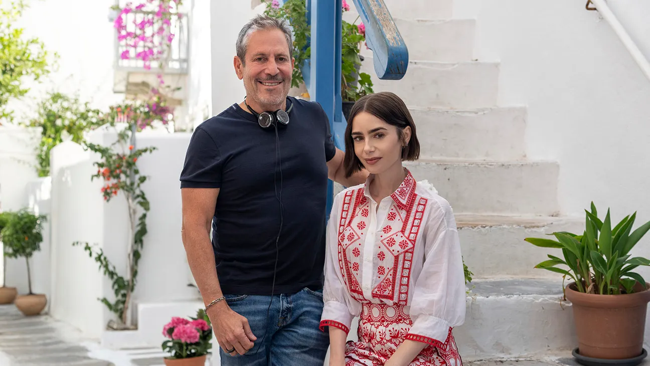 (L to R) Executive Producer/Creator Darren Star, Lily Collins as Emily on the set of Emily in Paris Season 6.