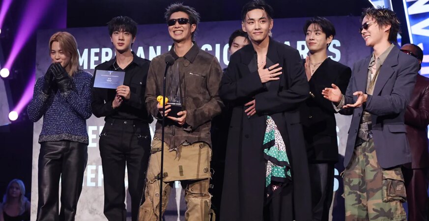 Jimin, Jin, RM, Suga, V, Jungkook and Jeongjin Park of BTS accept the Song of the Summer award for "Swim" onstage at The 52nd American Music Awards held at the MGM Grand Garden Arena on May 25, 2026 in Las Vegas, Nevada.