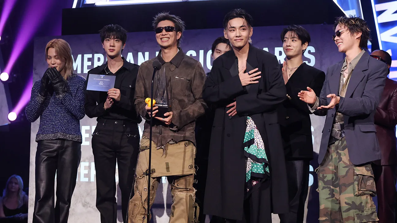 Jimin, Jin, RM, Suga, V, Jungkook and Jeongjin Park of BTS accept the Song of the Summer award for "Swim" onstage at The 52nd American Music Awards held at the MGM Grand Garden Arena on May 25, 2026 in Las Vegas, Nevada.