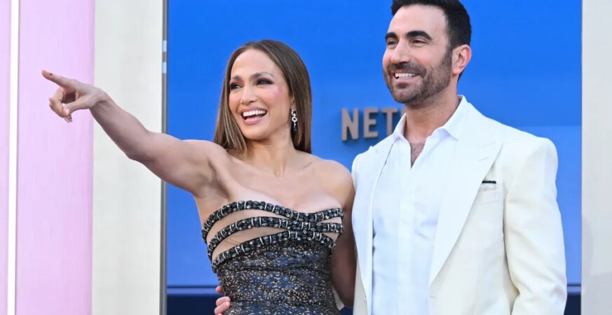 Jennifer Lopez on Meeting ‘Office Romance’ Co-Star Brett Goldstein for the First Time and That Viral ‘Off Campus’ Video: ‘The Show Is So Cute and I Love It’