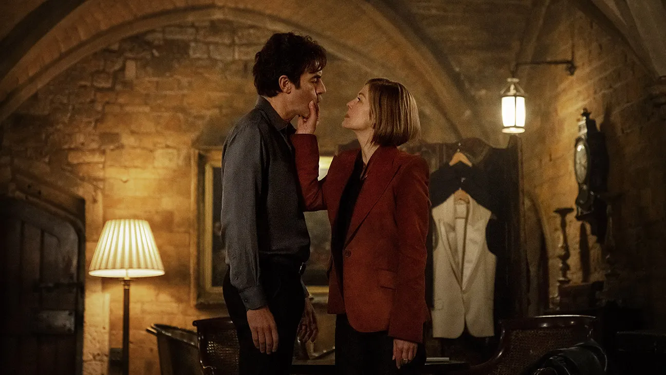 (L-R) Sacha Baron Cohen as Damien Sachs and Rosamund Pike as Alex Fox in Ladies First.