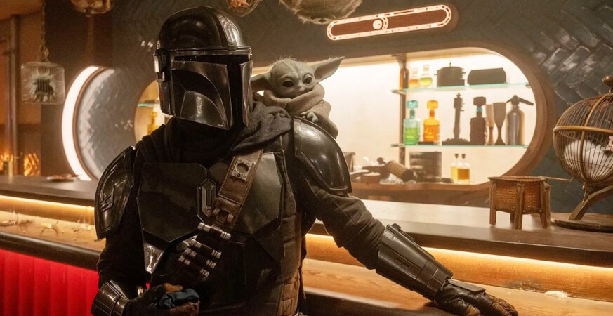 (L-R) Mandalorian (Pedro Pascal) and Grogu in Lucasfilm's The Mandalorian and Grogu