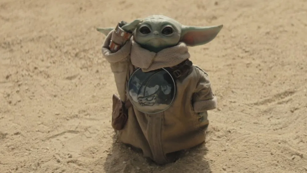 (L-R) Grogu and The Mandalorian (Pedro Pascal) in Lucasfilm's THE MANDALORIAN AND GROGU. Photo courtesy of Lucasfilm. © 2026 Lucasfilm Ltd". All Rights Reserved.
