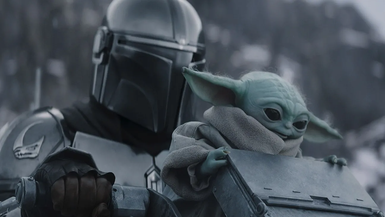 (L-R) The Mandalorian and Grogu in Lucasfilm's The Mandalorian and Grogu