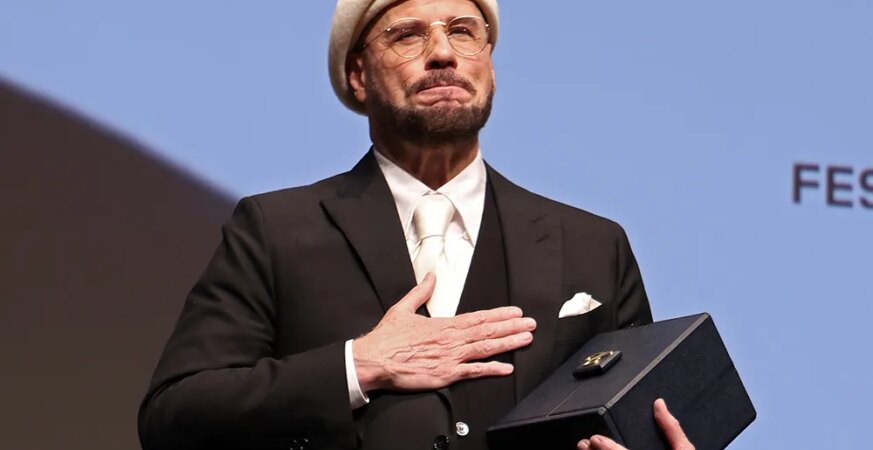 John Travolta Cries as Cannes Surprises Him With Honorary Palme d’Or: ‘This Is Beyond the Oscar’