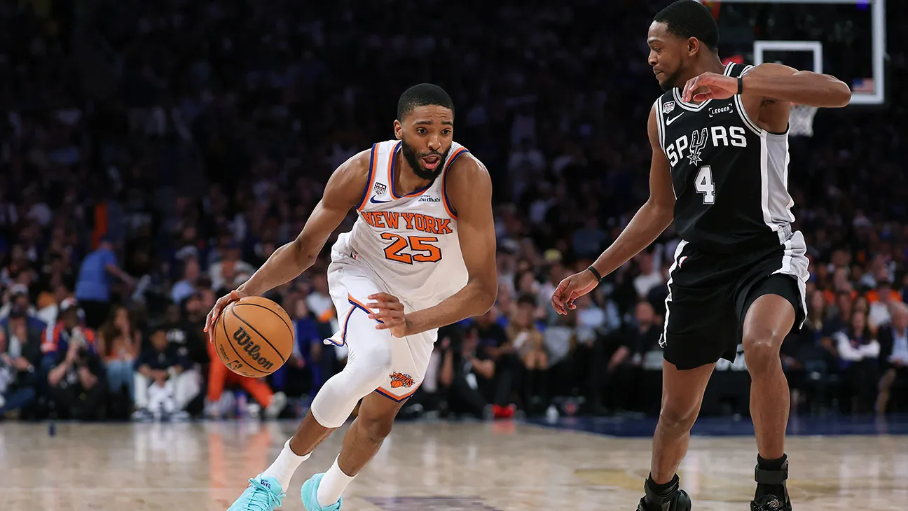 Mikal Bridges (25) of the New York Knicks drives against De'Aaron Fox of the San Antonio Spurs during game 3 of the 2026 NBA Finals.