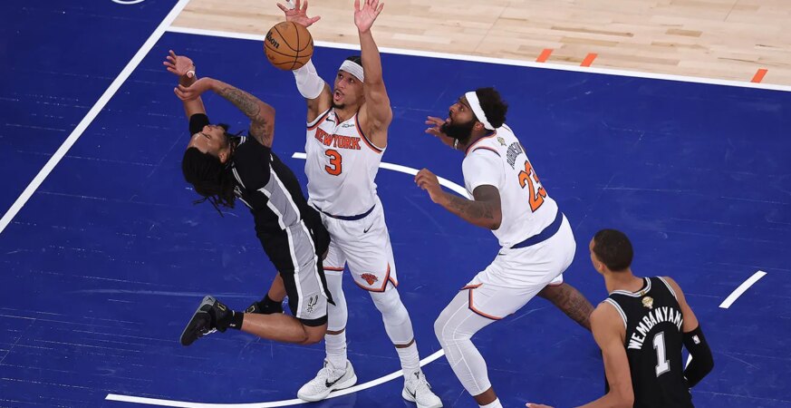 Stephon Castle #5 of the San Antonio Spurs shoots the ball against Josh Hart #3 of the New York Knicks on the final play of the fourth quarter in Game Four of the 2026 NBA Finals at Madison Square Garden on June 10, 2026 in New York City.