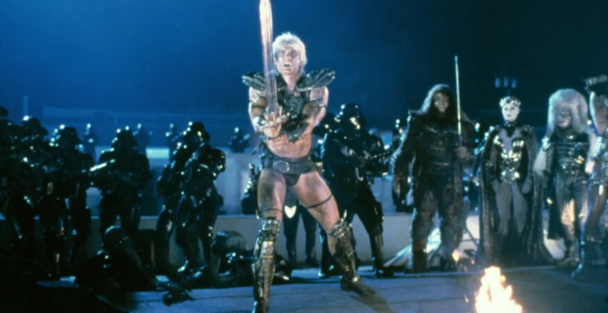 Dolph Lundgren, a former chemical engineer who gave up a Fulbright Scholarship to MIT to pursue acting, as He-Man in Masters of the Universe, which some critics compared unfavorably to Star Wars.