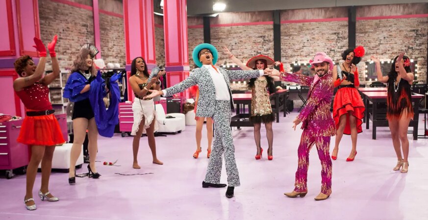 RuPaul (center) on RuPaul’s Drag Race season eight, for which he earned the first of eight consecutive reality host Emmy awards. THR announced the launch of the show in 2008.